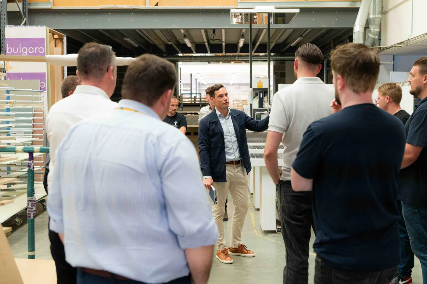 Tony Huggins, head of operations at Bulgaro, shows delegates on the programme round the Sittingbourne factory